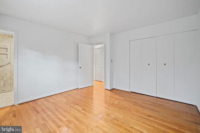 530 Anneslie Rd, Baltimore, MD 21212 - unfurnished bedroom with light wood-style flooring, baseboards, a closet, and ensuite bathroom