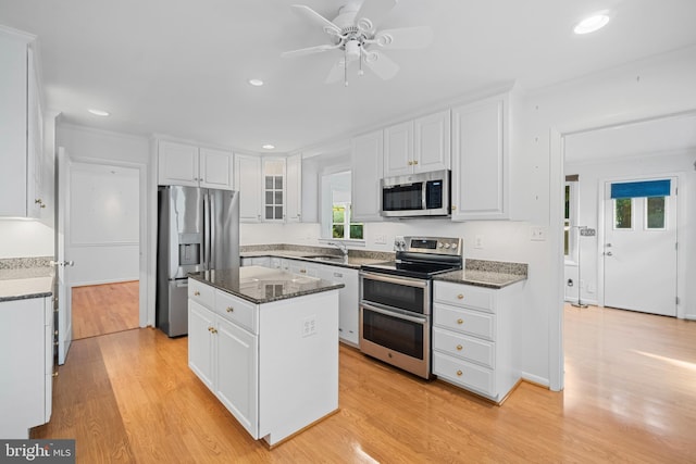 530 Anneslie Rd, Baltimore, MD 21212 - kitchen featuring appliances with stainless steel finishes, a sink, white cabinets, a kitchen island, and recessed lighting