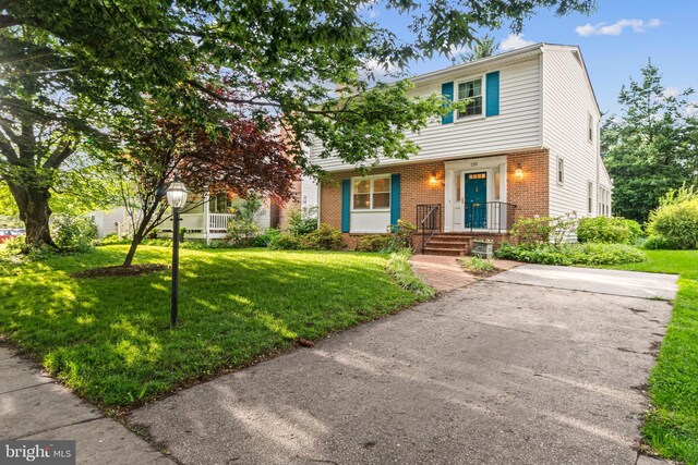 530 Anneslie Rd, Baltimore, MD 21212 - view of front of property featuring brick siding and a front lawn