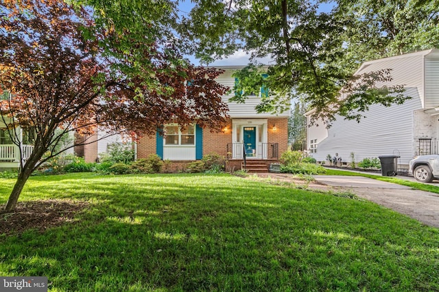 530 Anneslie Rd, Baltimore, MD 21212 - view of front of property with brick siding and a front lawn