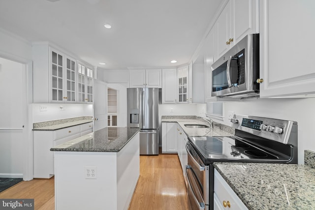 530 Anneslie Rd, Baltimore, MD 21212 - kitchen featuring stainless steel appliances, light wood-style floors, white cabinetry, and recessed lighting