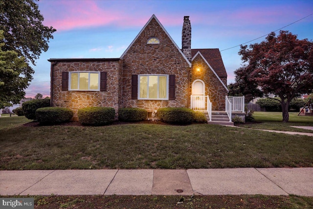 1807 King St, Reading, PA 19605 - view of front of property with stone siding, a lawn, and a chimney