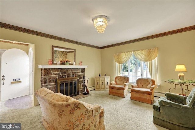 1807 King St, Reading, PA 19605 - carpeted living area featuring a baseboard radiator and a fireplace