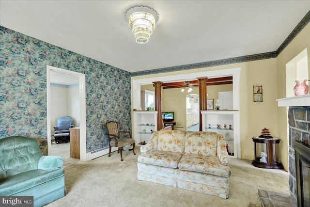 1807 King St, Reading, PA 19605 - living room featuring a stone fireplace, wallpapered walls, carpet, ceiling fan, and decorative columns