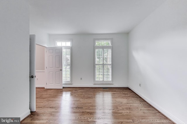 10106 Waterside Dr, Burke, VA 22015 - spare room with wood finished floors and baseboards