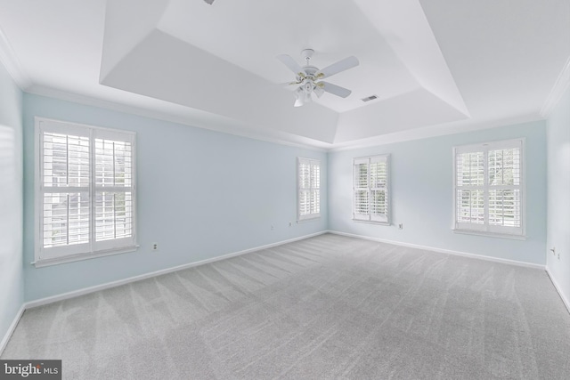 10106 Waterside Dr, Burke, VA 22015 - spare room featuring a tray ceiling, ceiling fan, carpet, plenty of natural light, and ornamental molding