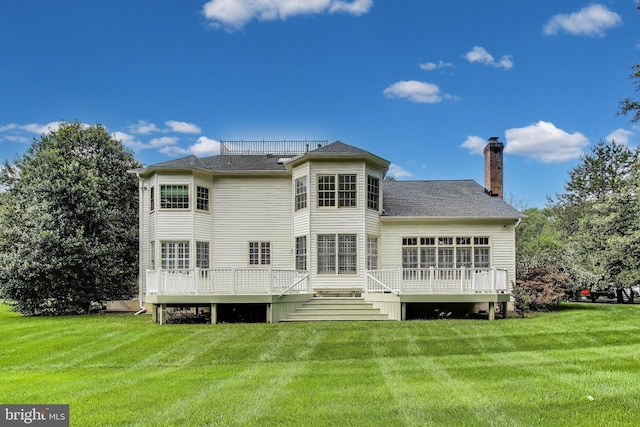 10106 Waterside Dr, Burke, VA 22015 - rear view of house featuring a chimney, a lawn, a deck, and a shingled roof