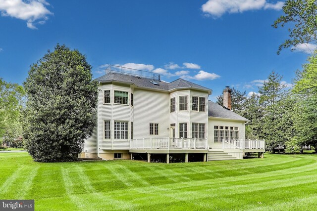 10106 Waterside Dr, Burke, VA 22015 - back of house featuring a chimney, a yard, and a deck