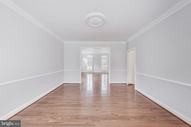 10106 Waterside Dr, Burke, VA 22015 - spare room with crown molding, light wood-style floors, and baseboards