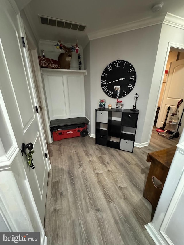 23 Winding Rd, Levittown, PA 19057 - mudroom with wood finished floors, crown molding, and baseboards