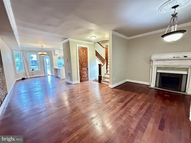 40 Bryant St NW, Washington, DC 20001 - unfurnished living room with a fireplace, dark wood-type flooring, ornamental molding, stairs, and baseboards