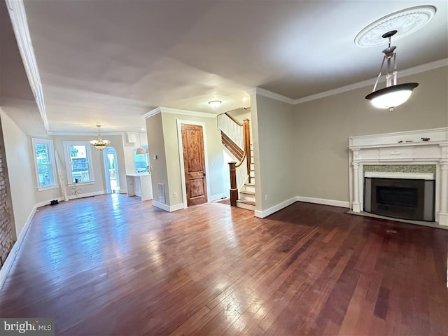40 Bryant St NW, Washington, DC 20001 - unfurnished living room featuring a fireplace with flush hearth, dark wood-type flooring, ornamental molding, stairs, and baseboards