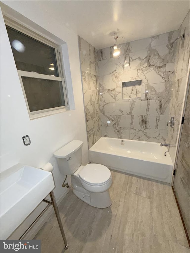 40 Bryant St NW, Washington, DC 20001 - full bathroom with toilet, tub / shower combination, and wood finished floors