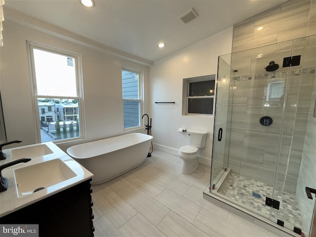 40 Bryant St NW, Washington, DC 20001 - bathroom featuring a freestanding bath, vanity, a shower stall, baseboards, and recessed lighting