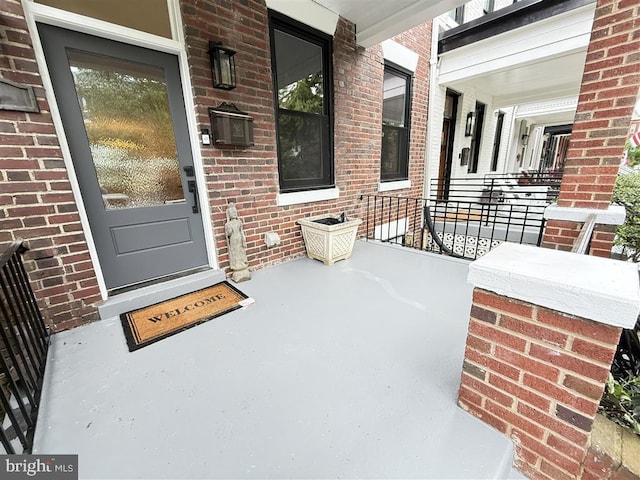 40 Bryant St NW, Washington, DC 20001 - property entrance featuring a porch and brick siding
