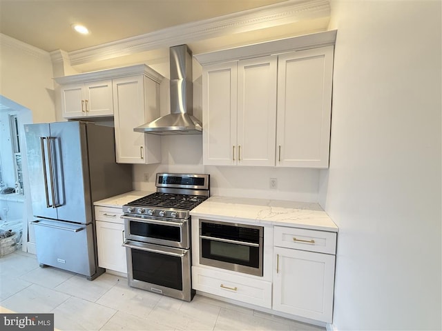 40 Bryant St NW, Washington, DC 20001 - kitchen with appliances with stainless steel finishes, wall chimney exhaust hood, crown molding, light stone countertops, and white cabinets