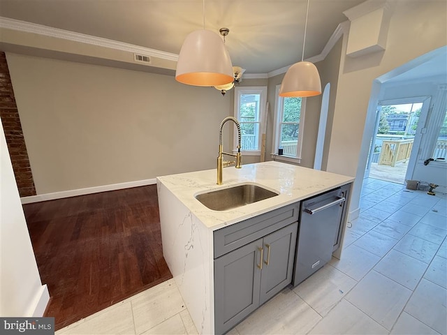40 Bryant St NW, Washington, DC 20001 - kitchen with stainless steel dishwasher, a sink, gray cabinets, crown molding, and healthy amount of natural light