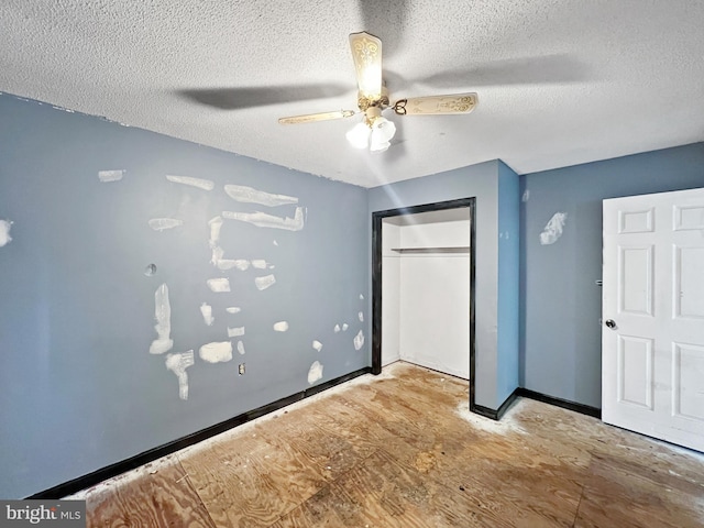 178 Fulton Ave, Charles Town, WV 25414 - unfurnished bedroom with a textured ceiling, a closet, baseboards, and a ceiling fan