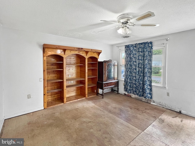 178 Fulton Ave, Charles Town, WV 25414 - unfurnished living room featuring a textured ceiling and a ceiling fan