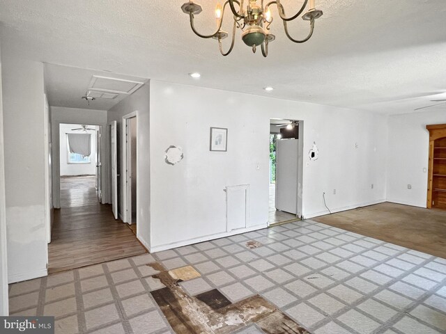 178 Fulton Ave, Charles Town, WV 25414 - interior space with baseboards, a chandelier, a textured ceiling, light floors, and recessed lighting