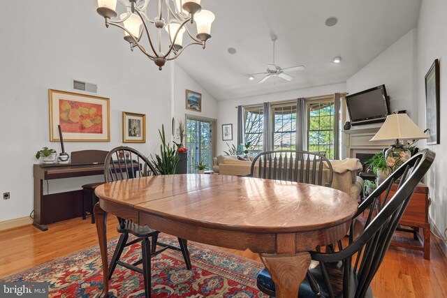 66 Farmview Ln, Lititz, PA 17543 - dining space featuring light wood-type flooring, plenty of natural light, lofted ceiling, ceiling fan, and a chandelier