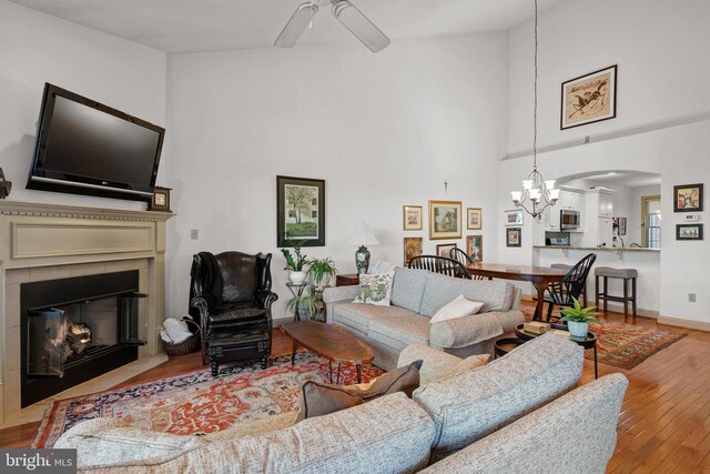 66 Farmview Ln, Lititz, PA 17543 - living room featuring high vaulted ceiling, ceiling fan, a chandelier, hardwood / wood-style flooring, and arched walkways
