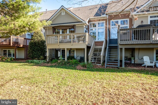 66 Farmview Ln, Lititz, PA 17543 - back of property with stairs, a deck, a lawn, and a shingled roof