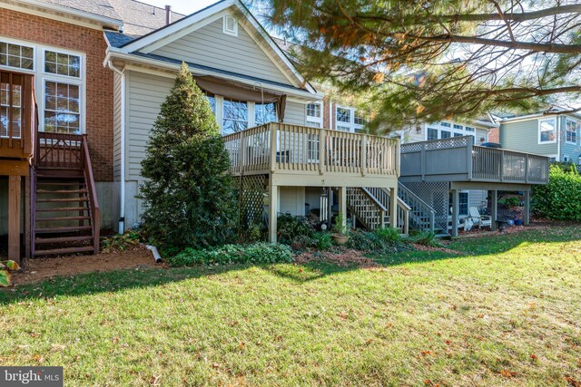 66 Farmview Ln, Lititz, PA 17543 - back of house featuring stairs, a wooden deck, and a yard