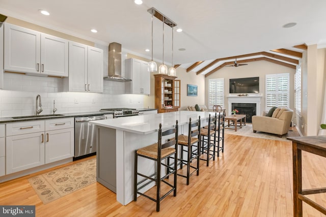 285 Cherry Ln, Kennett Square, PA 19348 - kitchen with wall chimney range hood, a sink, dishwasher, a kitchen bar, and backsplash