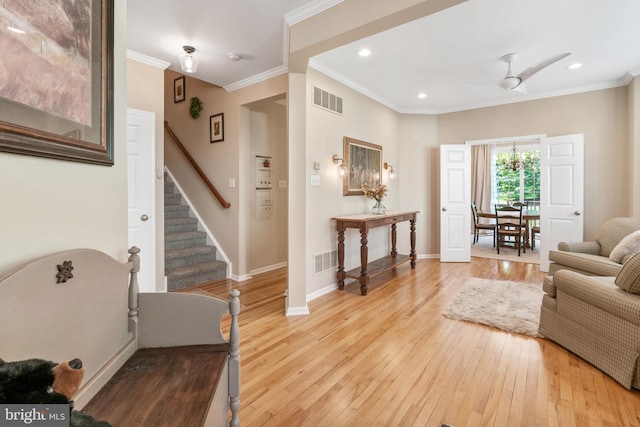 285 Cherry Ln, Kennett Square, PA 19348 - living area featuring stairs, light wood-type flooring, crown molding, baseboards, and ceiling fan