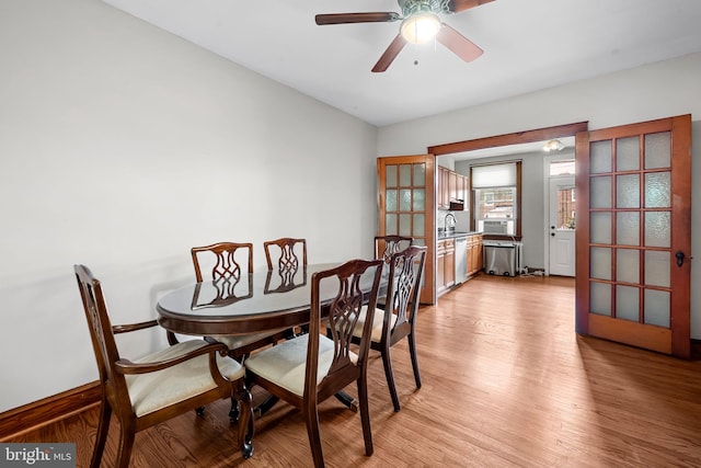 434 Elrino St, Baltimore, MD 21224 - dining area featuring light wood-type flooring and a ceiling fan