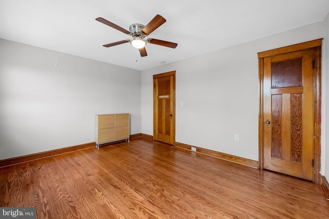 434 Elrino St, Baltimore, MD 21224 - unfurnished bedroom with baseboards, light wood-style flooring, and ceiling fan