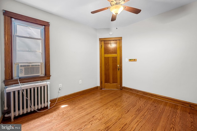 434 Elrino St, Baltimore, MD 21224 - spare room with radiator, baseboards, light wood-style flooring, cooling unit, and ceiling fan