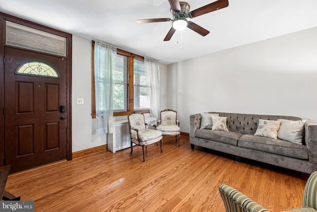 434 Elrino St, Baltimore, MD 21224 - living area featuring light wood-type flooring, baseboards, plenty of natural light, and ceiling fan