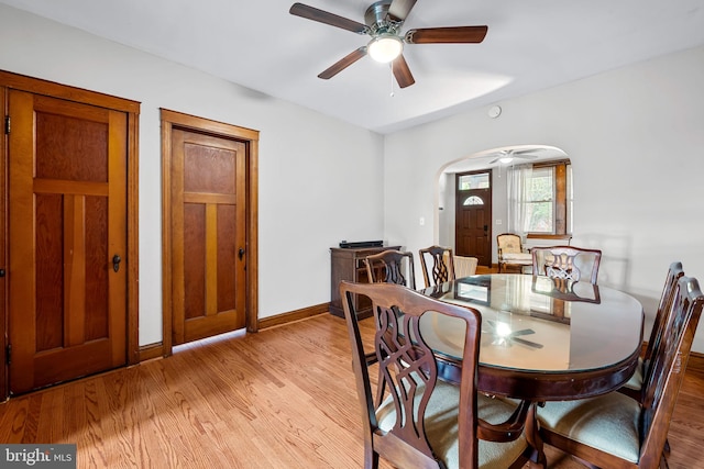 434 Elrino St, Baltimore, MD 21224 - dining space with wood finished floors, arched walkways, a ceiling fan, and baseboards