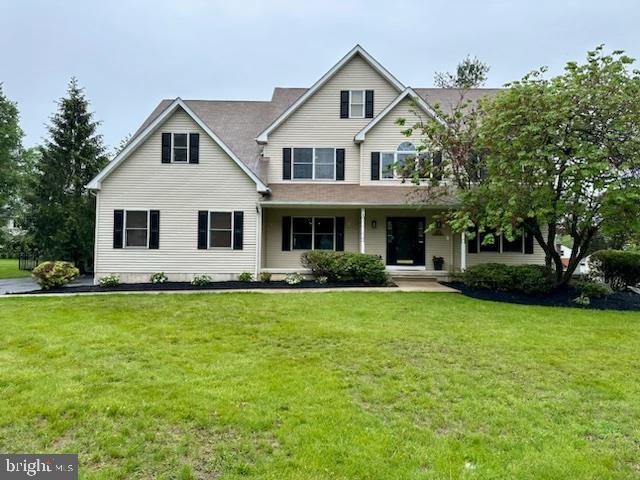 10 Evans Ln, Lawrenceville, NJ 08648 - view of front facade featuring a front yard and covered porch