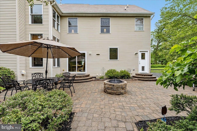 10 Evans Ln, Lawrenceville, NJ 08648 - rear view of property with an outdoor fire pit, a patio area, and entry steps