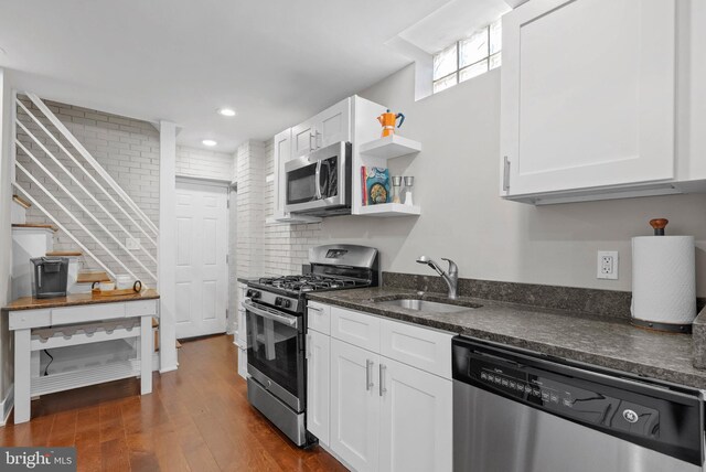 154 Mercy St, Philadelphia, PA 19148 - kitchen featuring stainless steel appliances, a sink, open shelves, white cabinets, and recessed lighting