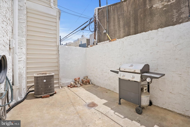 154 Mercy St, Philadelphia, PA 19148 - fenced backyard featuring central air condition unit, grilling area, and a patio area