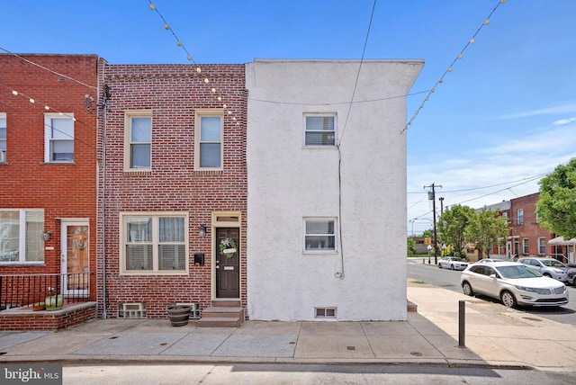 154 Mercy St, Philadelphia, PA 19148 - multi unit property featuring entry steps, stucco siding, and brick siding