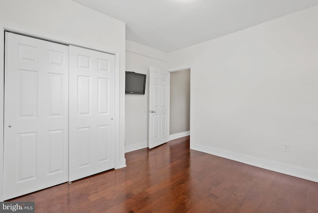 154 Mercy St, Philadelphia, PA 19148 - unfurnished bedroom with wood finished floors, baseboards, and a closet