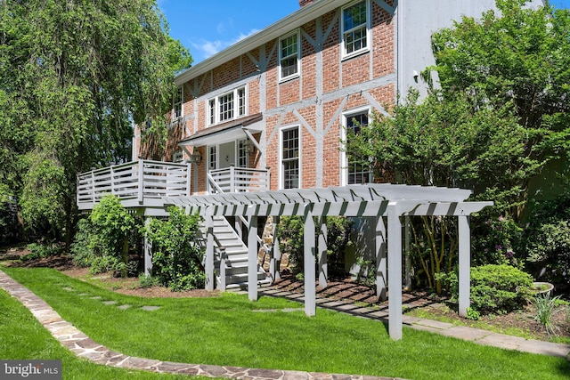 563 Cherry Valley Rd, Princeton, NJ 08540 - rear view of house with a lawn, brick siding, stairs, and a deck