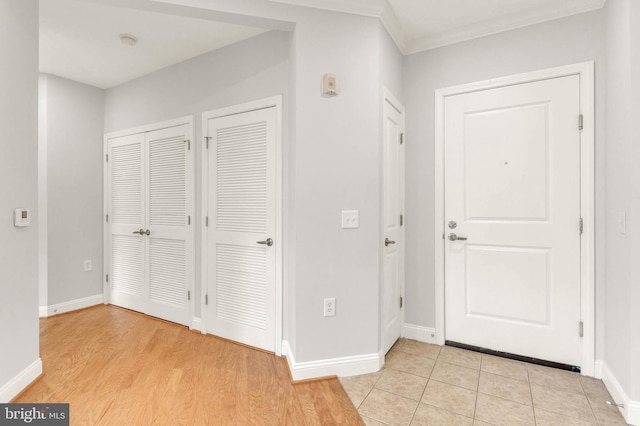 1391 Pennsylvania Ave SE Unit 348, Washington, DC 20003 - foyer featuring crown molding, baseboards, and light wood-style floors