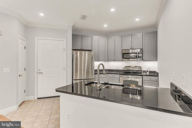 1391 Pennsylvania Ave SE Unit 348, Washington, DC 20003 - kitchen featuring stainless steel appliances, a sink, dark countertops, gray cabinets, and recessed lighting