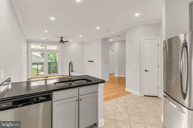 1391 Pennsylvania Ave SE Unit 348, Washington, DC 20003 - kitchen featuring appliances with stainless steel finishes, a sink, ornamental molding, ceiling fan, and dark countertops