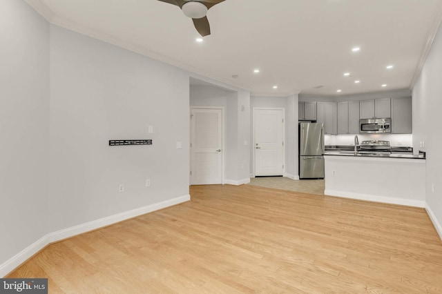 1391 Pennsylvania Ave SE Unit 348, Washington, DC 20003 - kitchen featuring appliances with stainless steel finishes, gray cabinets, recessed lighting, a sink, and light wood-style floors