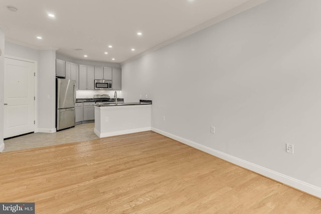 1391 Pennsylvania Ave SE Unit 348, Washington, DC 20003 - kitchen featuring stainless steel appliances, a peninsula, dark countertops, recessed lighting, and baseboards