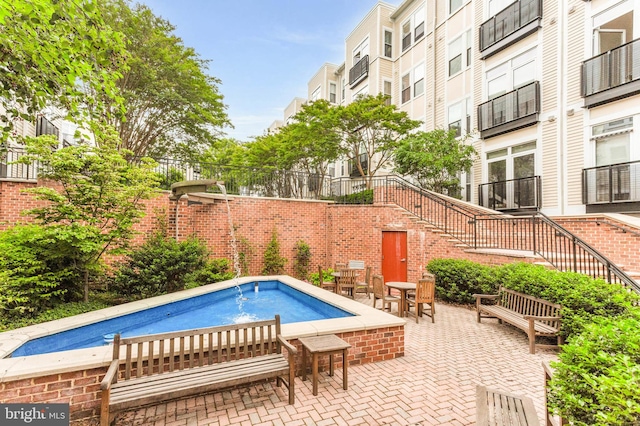 1391 Pennsylvania Ave SE Unit 348, Washington, DC 20003 - view of pool with stairs and a patio
