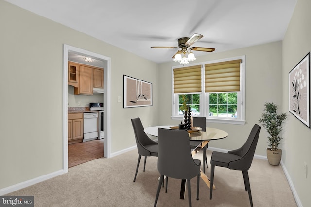 6517 Potomac Ave Unit A2, Alexandria, VA 22307 - dining room featuring light colored carpet, baseboards, and ceiling fan