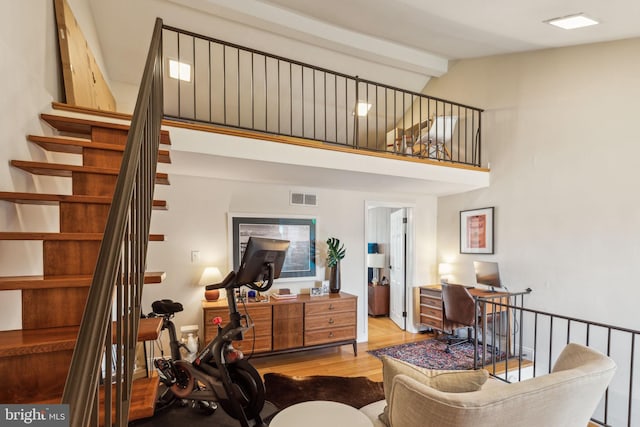 1011 Dickinson St, Philadelphia, PA 19147 - living room with wood finished floors, high vaulted ceiling, and stairs